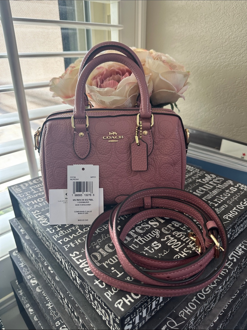 Coach mini Rowan signature leather in the color peony